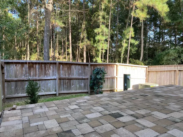 a view of a backyard with swimming pool