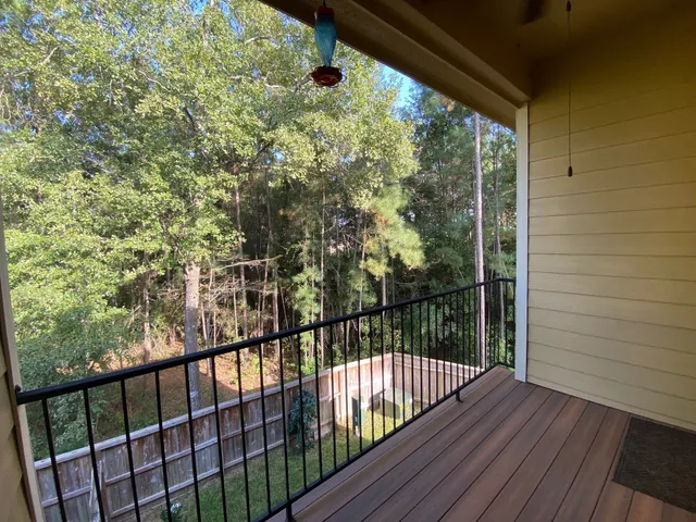 a view of balcony with wooden floor