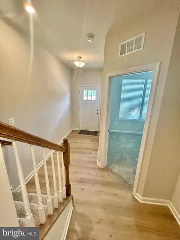 a front view of a house with glass windows and door