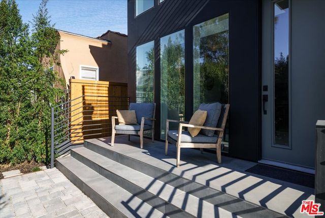 a outdoor space with patio the couches and chairs with wooden floor