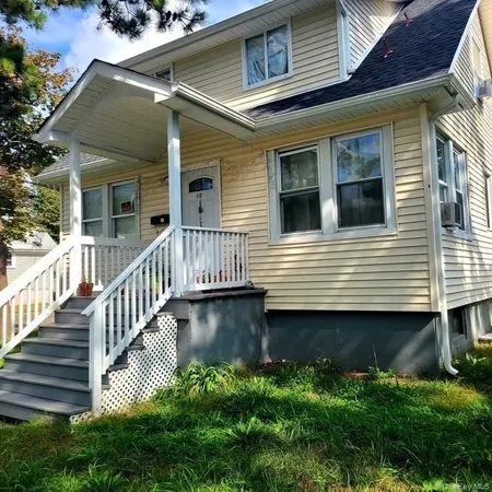 a view of a house with pool and deck