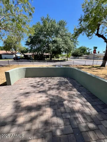 a view of swimming pool with a yard