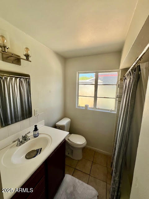 1321 South College Avenue Tempe, AZ 85281 - Photo 3 of 14 a bathroom with a sink toilet and shower