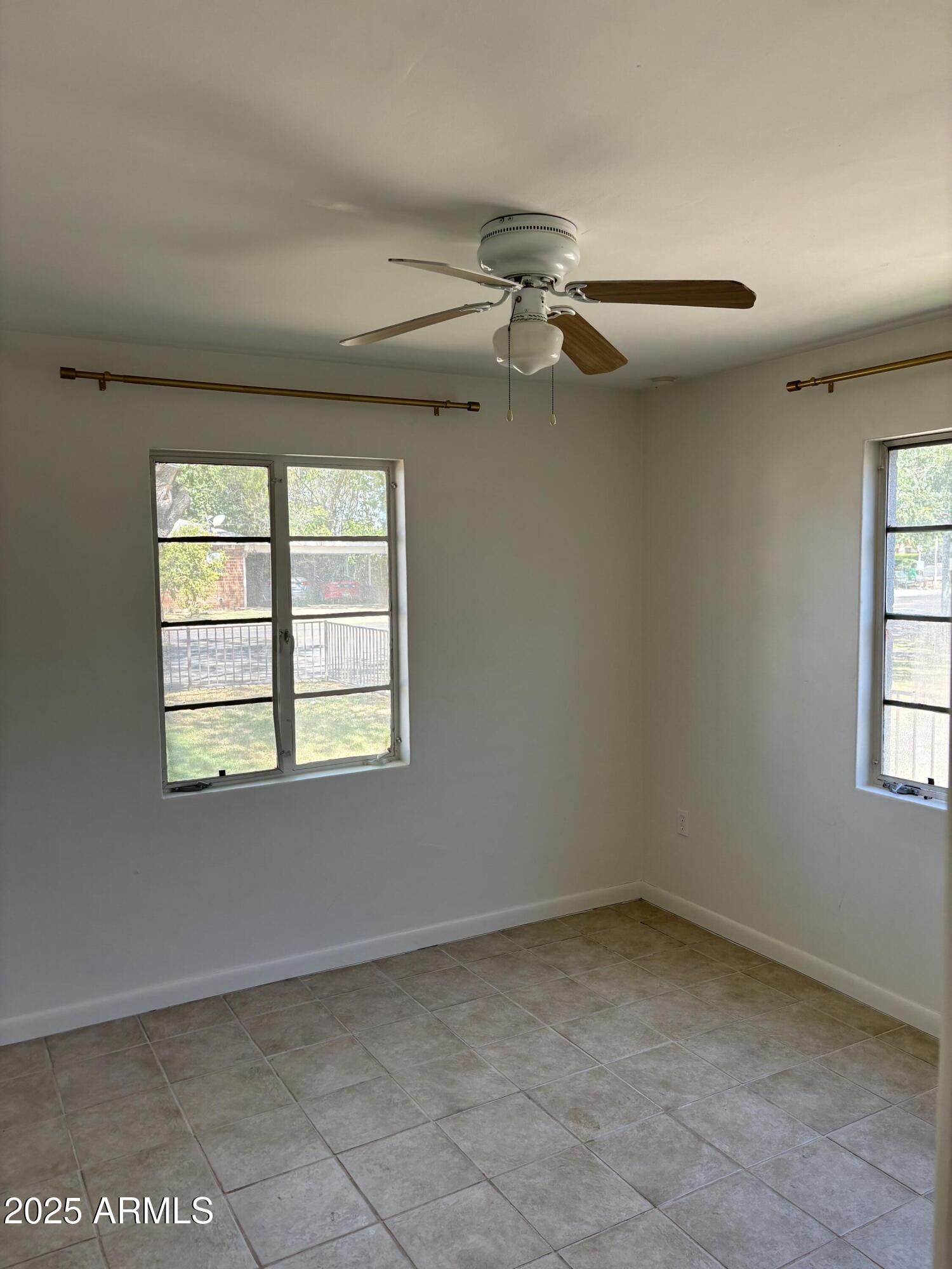 1321 South College Avenue Tempe, AZ 85281 - Photo 6 of 14 an empty room with windows