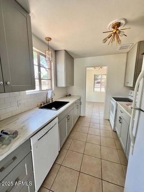 1321 South College Avenue Tempe, AZ 85281 - Photo 8 of 14 a kitchen with a sink a stove cabinets and a window