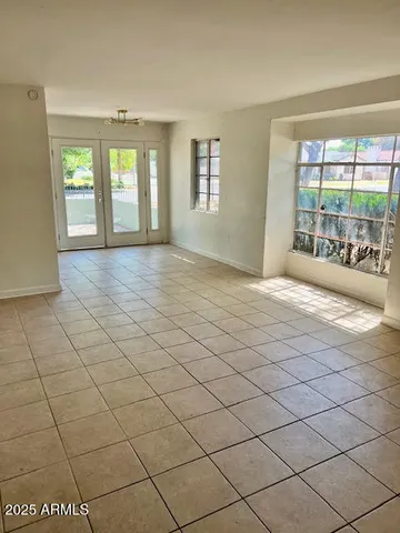 a view of an empty room and window