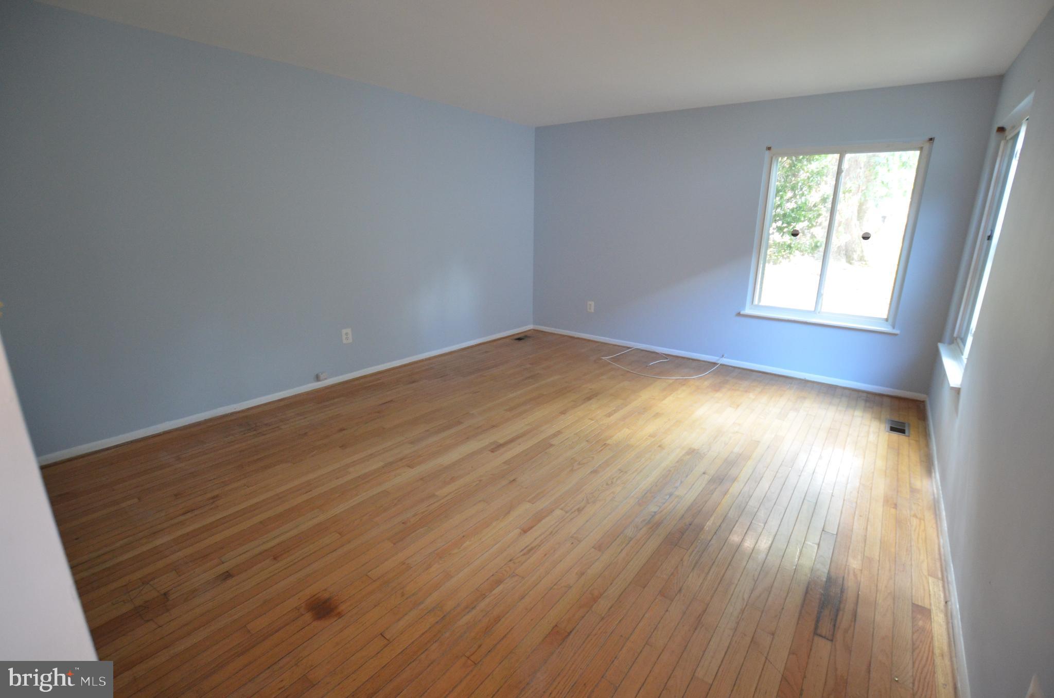 36 Steven Court, Unit 211 Gaithersburg, MD 20877 - Photo 14 of 24 a view of empty room with wooden floor and fan