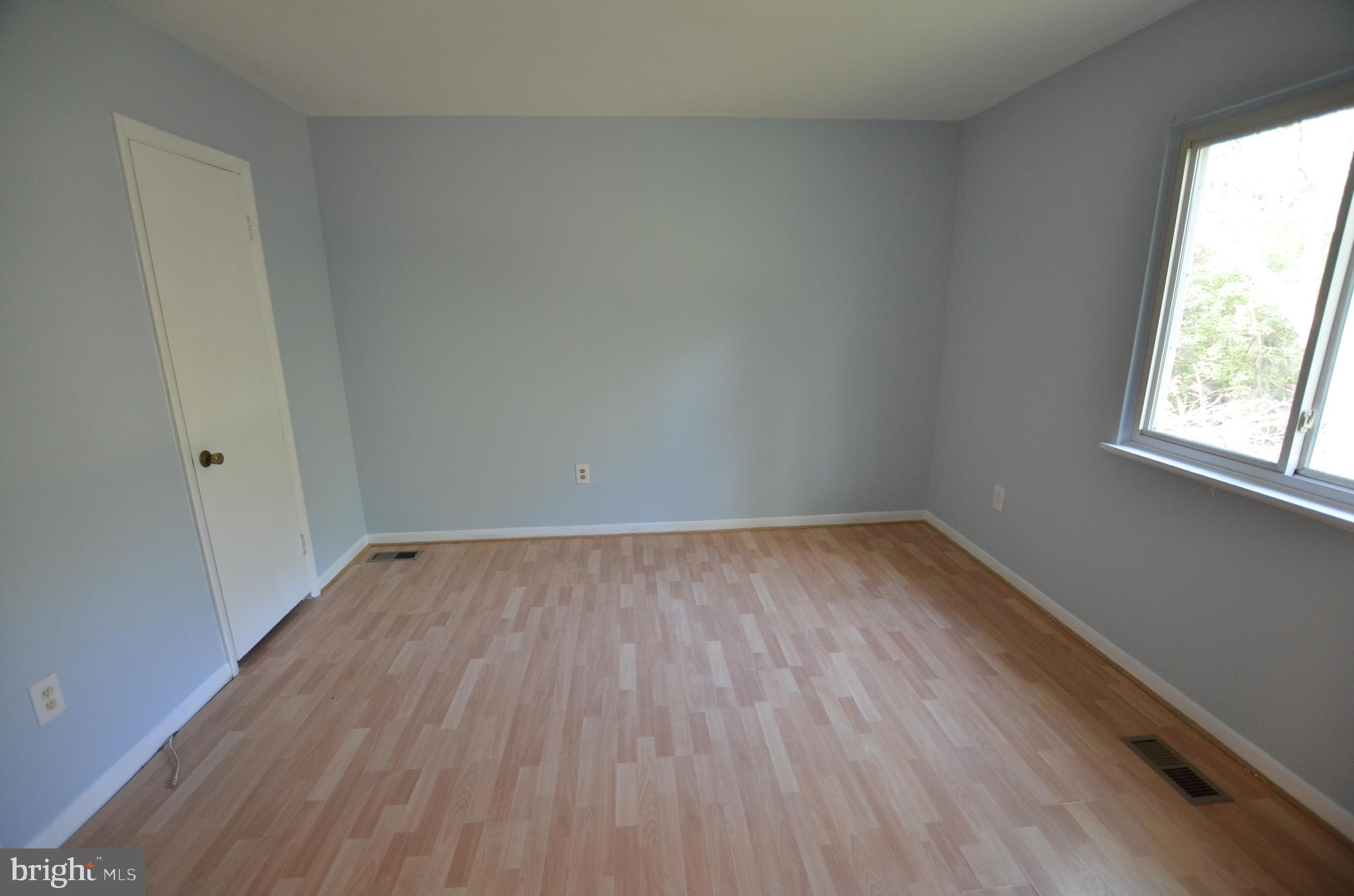 36 Steven Court, Unit 211 Gaithersburg, MD 20877 - Photo 17 of 24 a view of a room that has wooden floor and windows in it