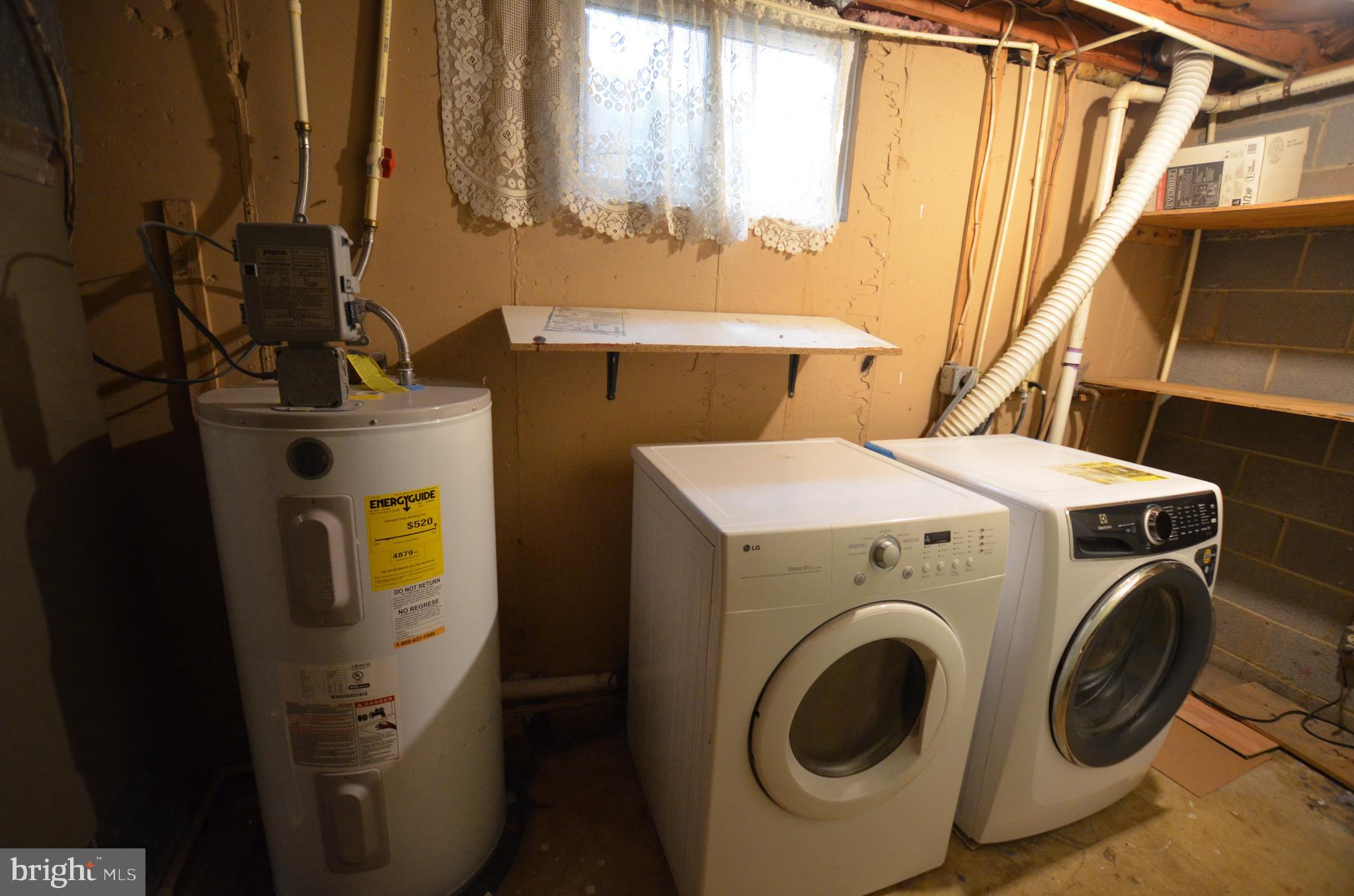 36 Steven Court, Unit 211 Gaithersburg, MD 20877 - Photo 23 of 24 a utility room with dryer and washer