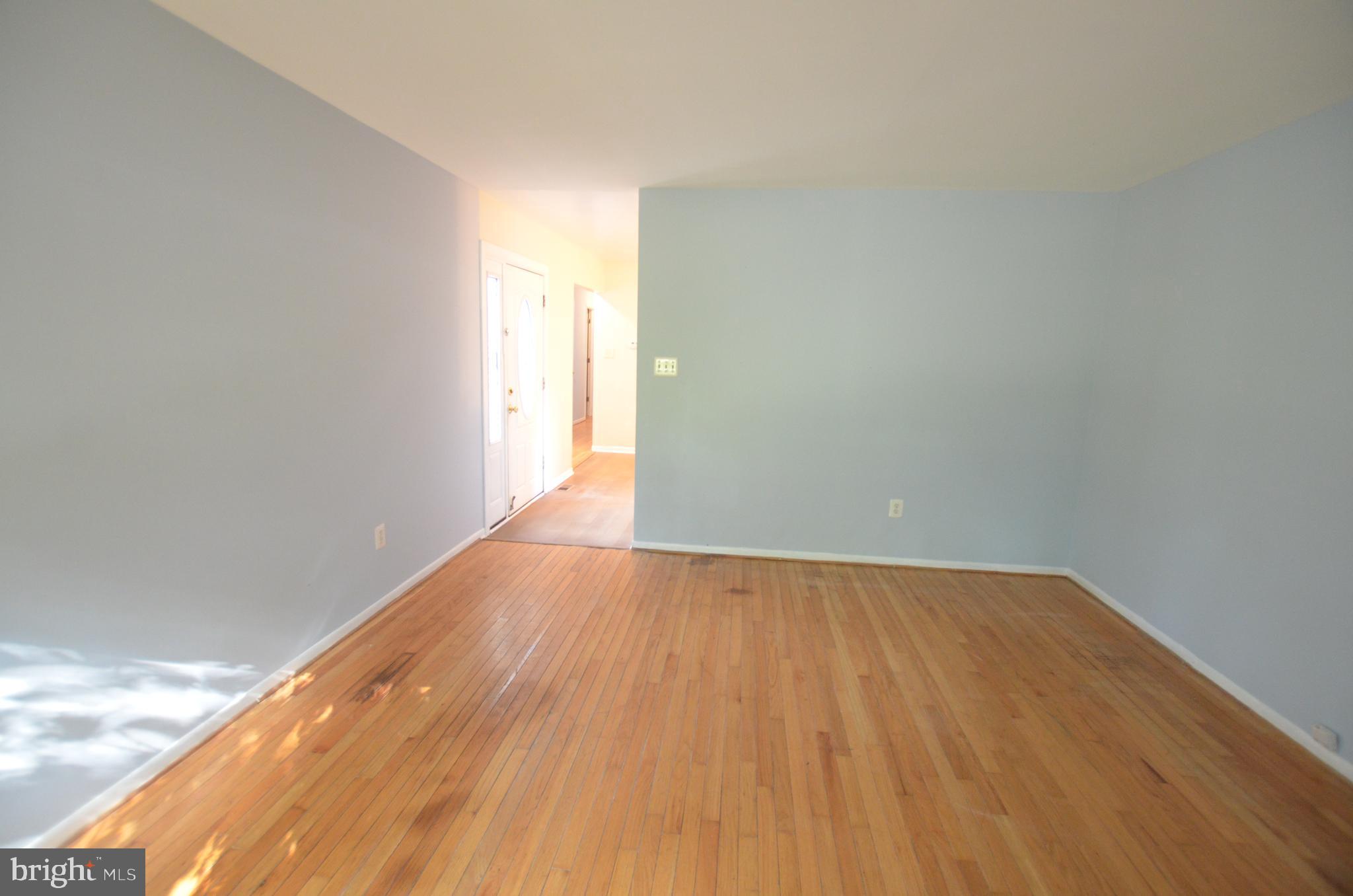 36 Steven Court, Unit 211 Gaithersburg, MD 20877 - Photo 9 of 24 a view of an empty room and wooden floor