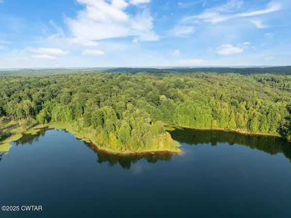 a view of a lake with a big yard