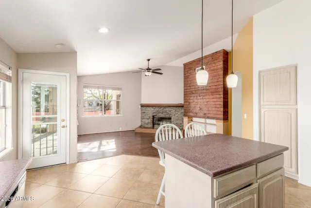 a kitchen with a table and chairs