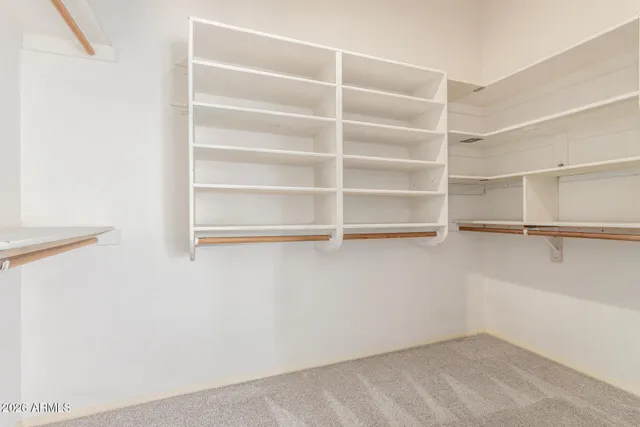 a view of an empty walk in closet