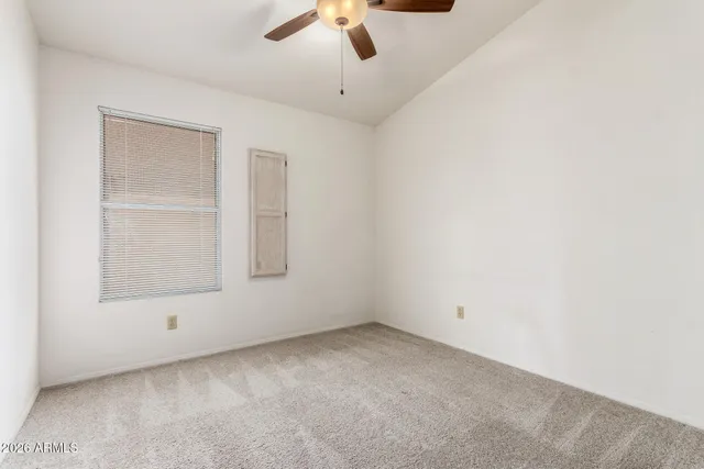 an empty room with a empty space and windows