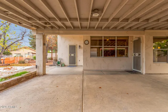 a view of yard with tree in front of it
