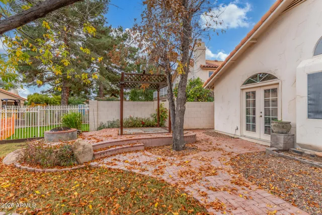 a view of a patio with a table chairs and a patio