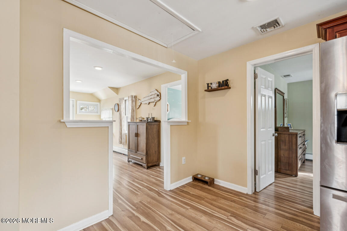 699 Mantoloking Road Brick, NJ 08723 - Photo 20 of 35 a view of a hallway with wooden floor and closet