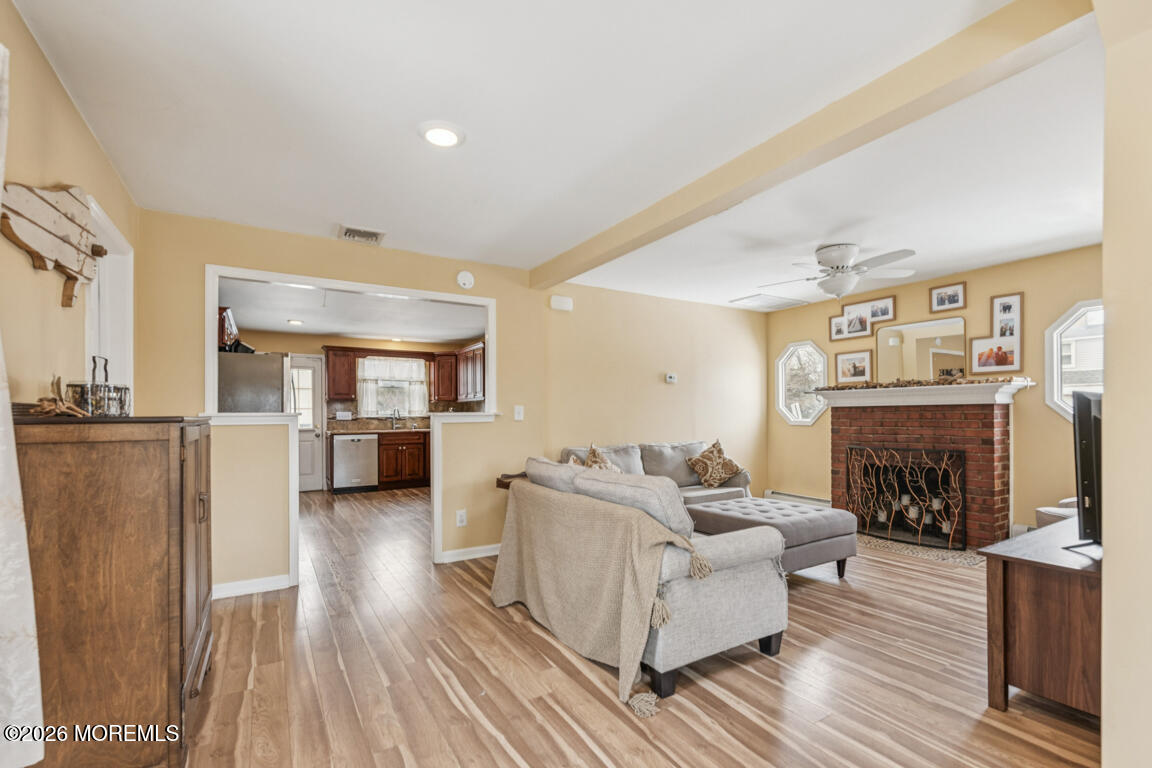 699 Mantoloking Road Brick, NJ 08723 - Photo 21 of 35 a living room with furniture and a fireplace