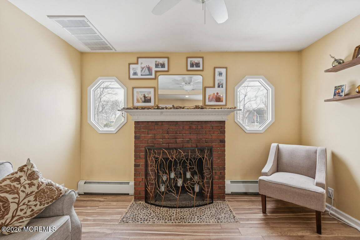699 Mantoloking Road Brick, NJ 08723 - Photo 22 of 35 a living room with furniture and a fireplace