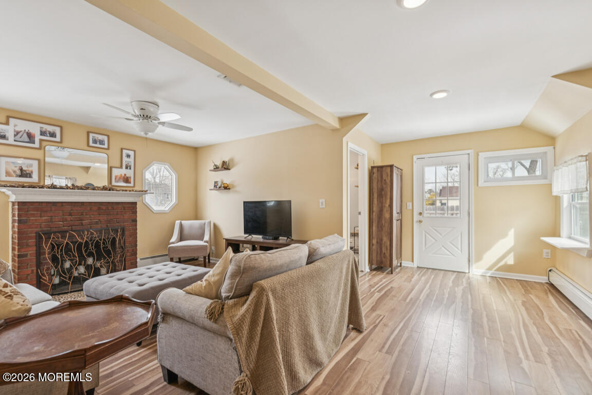699 Mantoloking Road Brick, NJ 08723 - Photo 23 of 35 a living room with furniture and a fireplace