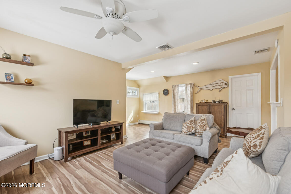 699 Mantoloking Road Brick, NJ 08723 - Photo 24 of 35 a living room with furniture and a flat screen tv
