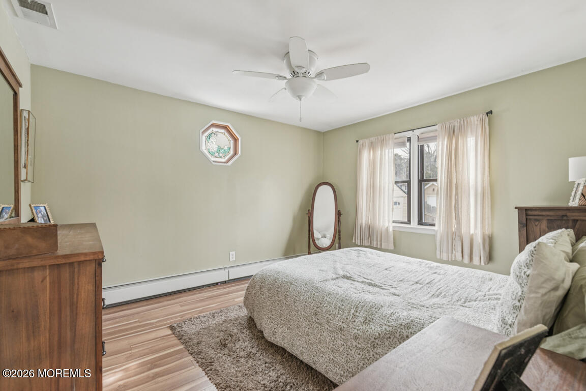 699 Mantoloking Road Brick, NJ 08723 - Photo 26 of 35 a bedroom with a bed and a dresser