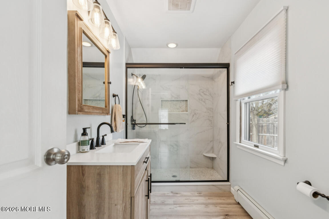 699 Mantoloking Road Brick, NJ 08723 - Photo 29 of 35 a bathroom with a sink mirror and shower