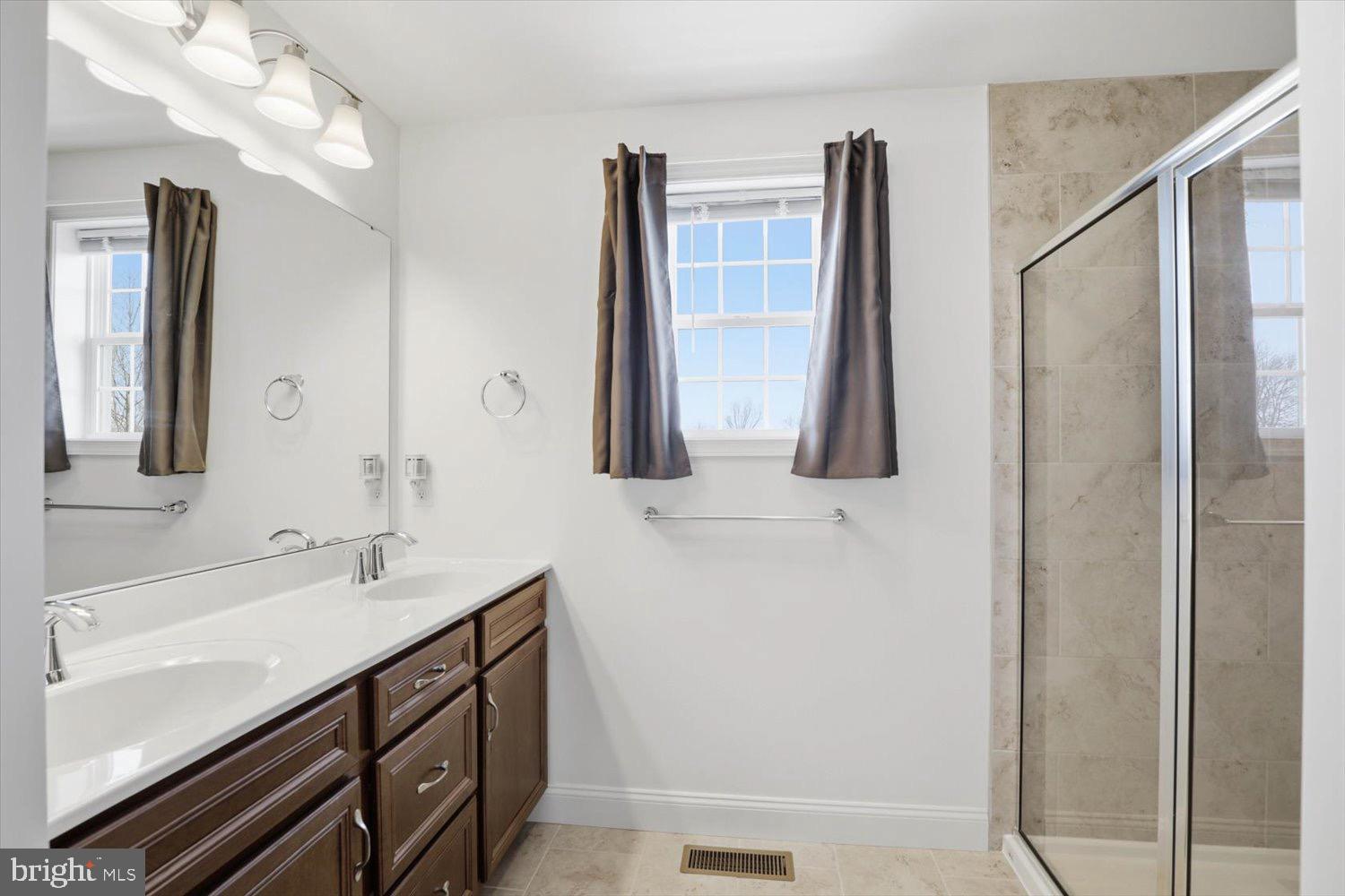 95 Red Maple Drive Etters, PA 17319 - Photo 8 of 42 a bathroom with a double vanity sink and mirror