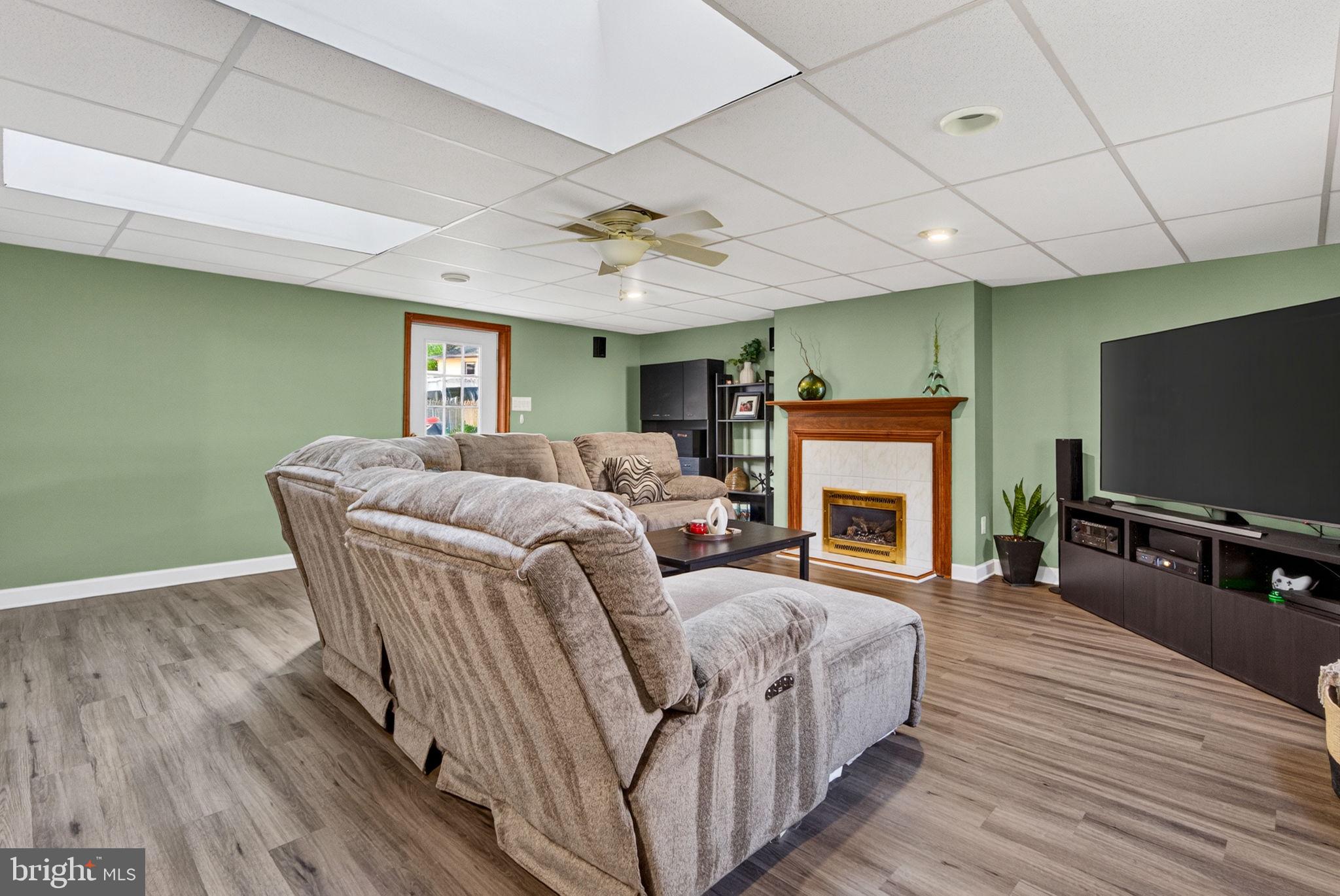 12 Woodbridge Road Gibbsboro, NJ 08026 - Photo 13 of 45 a living room with furniture and a flat screen tv