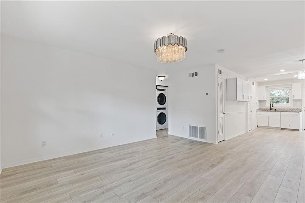 3510 Roswell Road, Unit C2 Atlanta, GA 30305 - Photo 4 of 24 a view of a room with wooden floor and window
