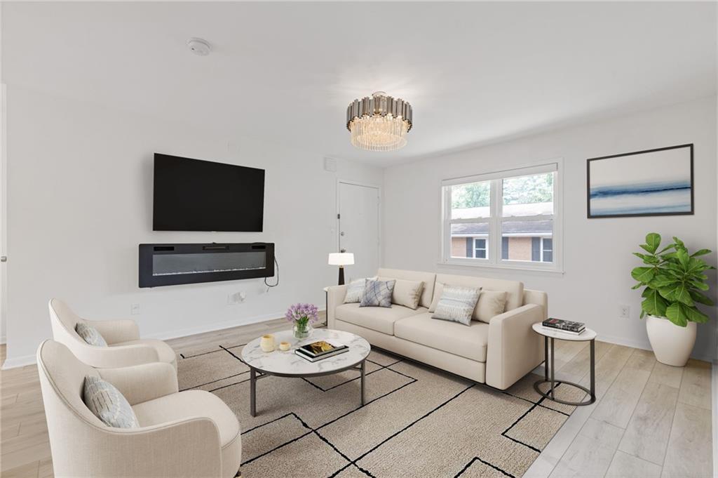 3510 Roswell Road, Unit C2 Atlanta, GA 30305 - Photo 5 of 24 a living room with furniture and a flat screen tv