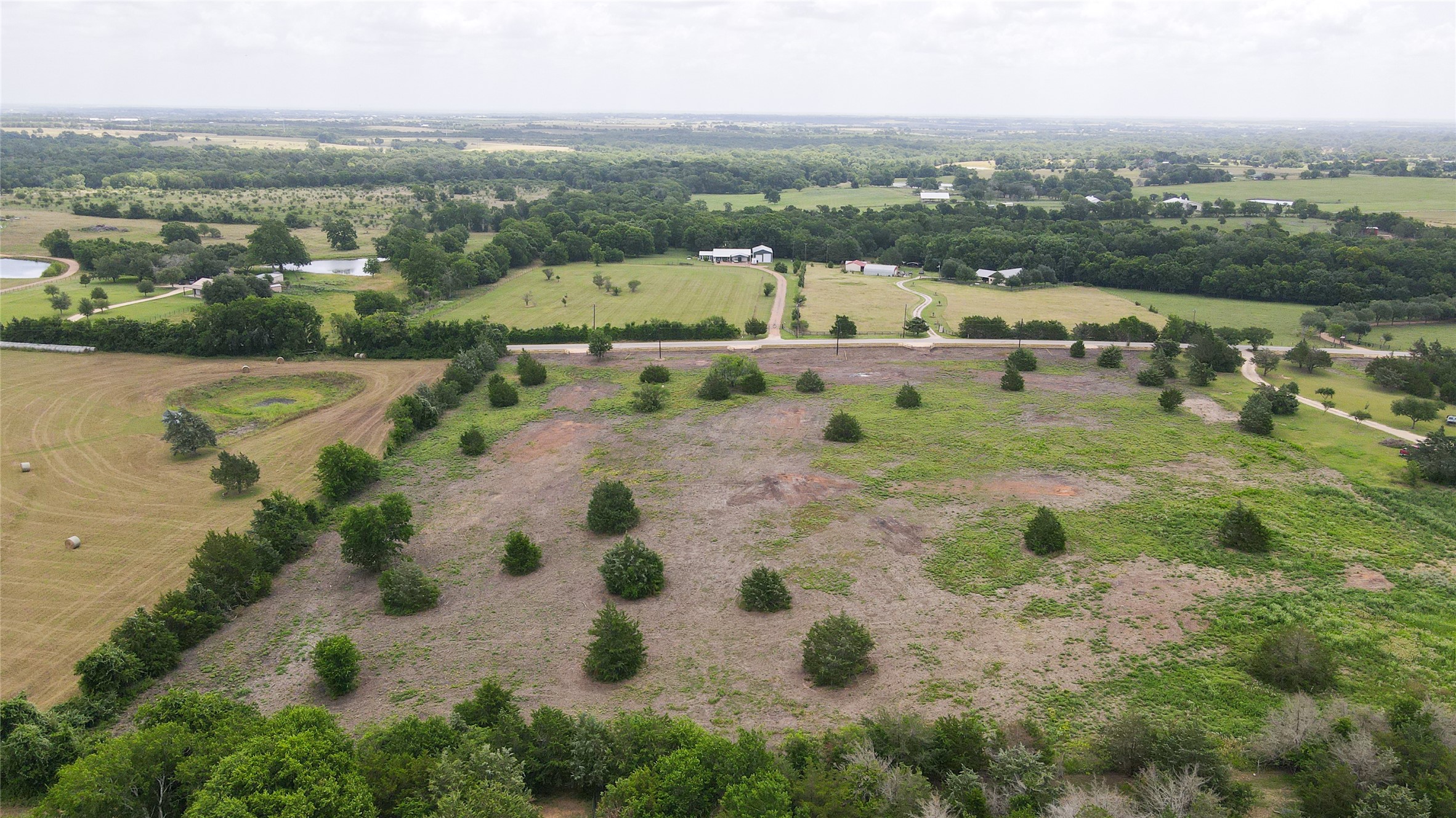 Lot 1 Wonder Hill Road Chappell Hill, TX 77426 - Photo 13 of 16 an aerial view of a city with lots of residential buildings