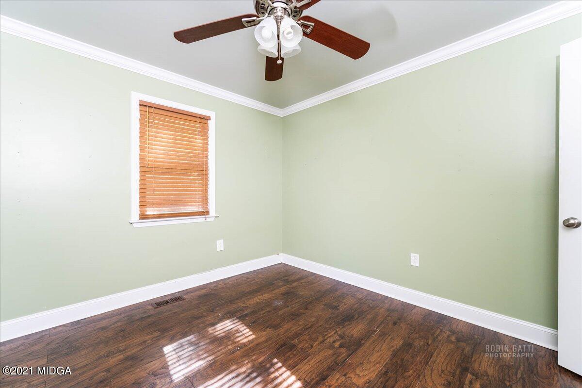 1939 Dames Ferry Road Forsyth, GA 31029 - Photo 14 of 29 an empty room with a window and a ceiling fan