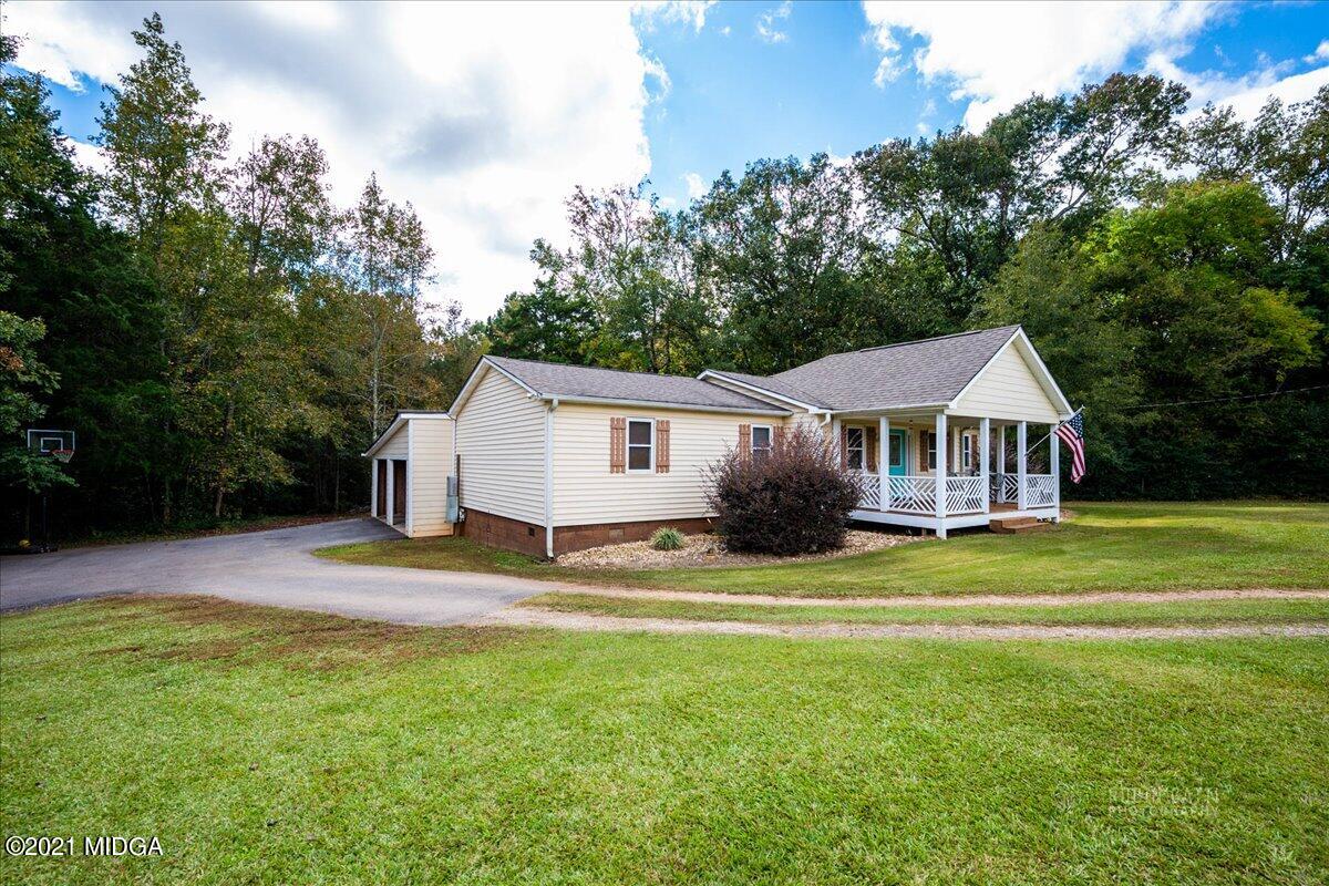 1939 Dames Ferry Road Forsyth, GA 31029 - Photo 21 of 29 a front view of a house with a yard