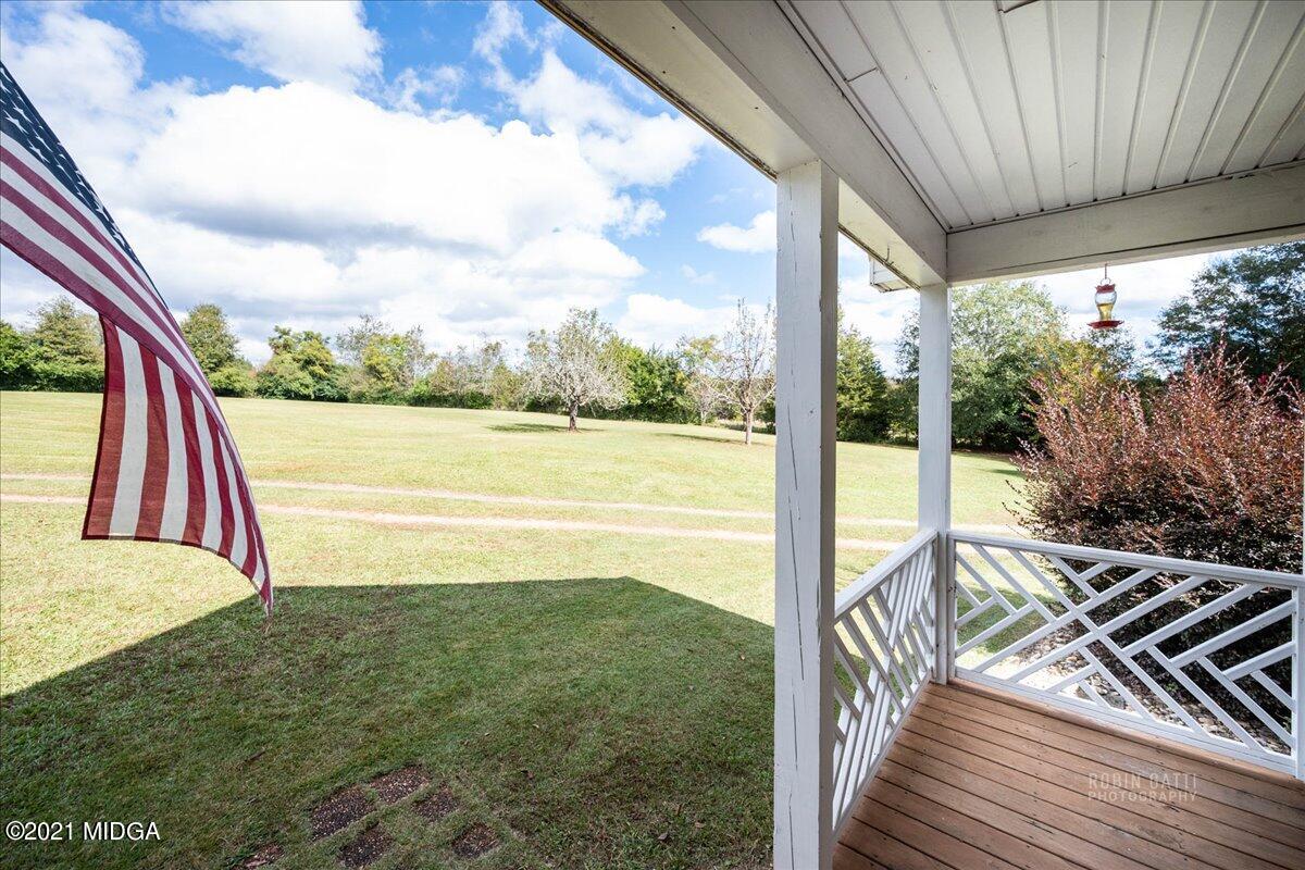 1939 Dames Ferry Road Forsyth, GA 31029 - Photo 22 of 29 a view of a balcony with floor to ceiling windows with wooden floor