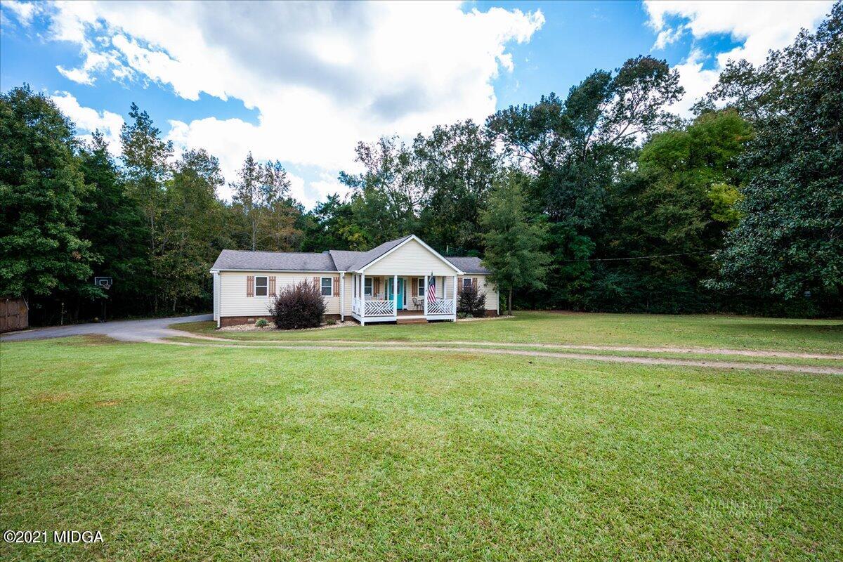 1939 Dames Ferry Road Forsyth, GA 31029 - Photo 29 of 29 a front view of a house with a garden