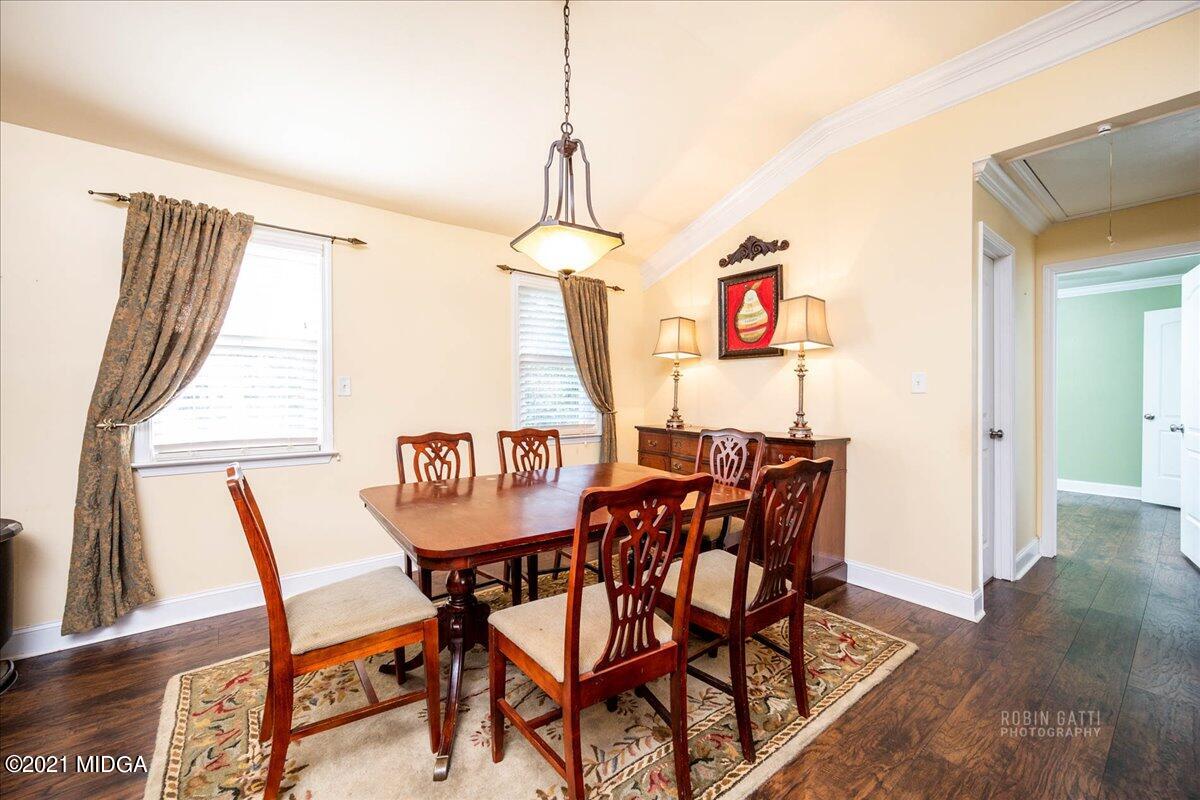 1939 Dames Ferry Road Forsyth, GA 31029 - Photo 6 of 29 a view of a dining room with furniture and wooden floor