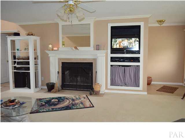 6615 Frank Reeder Road Pensacola, FL 32526 - Photo 3 of 13 Great room with wood burning fireplace and Built-in TV/Media Component Station