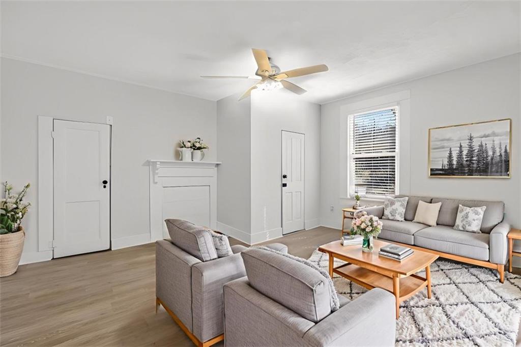 246 Spring Street Commerce, GA 30529 - Photo 11 of 23 a living room with furniture and a window