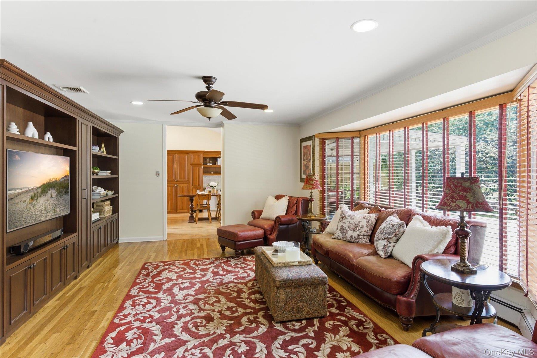 6 Brandy Road Cold Spring Harbor, NY 11724 - Photo 9 of 25 a living room with furniture and a flat screen tv