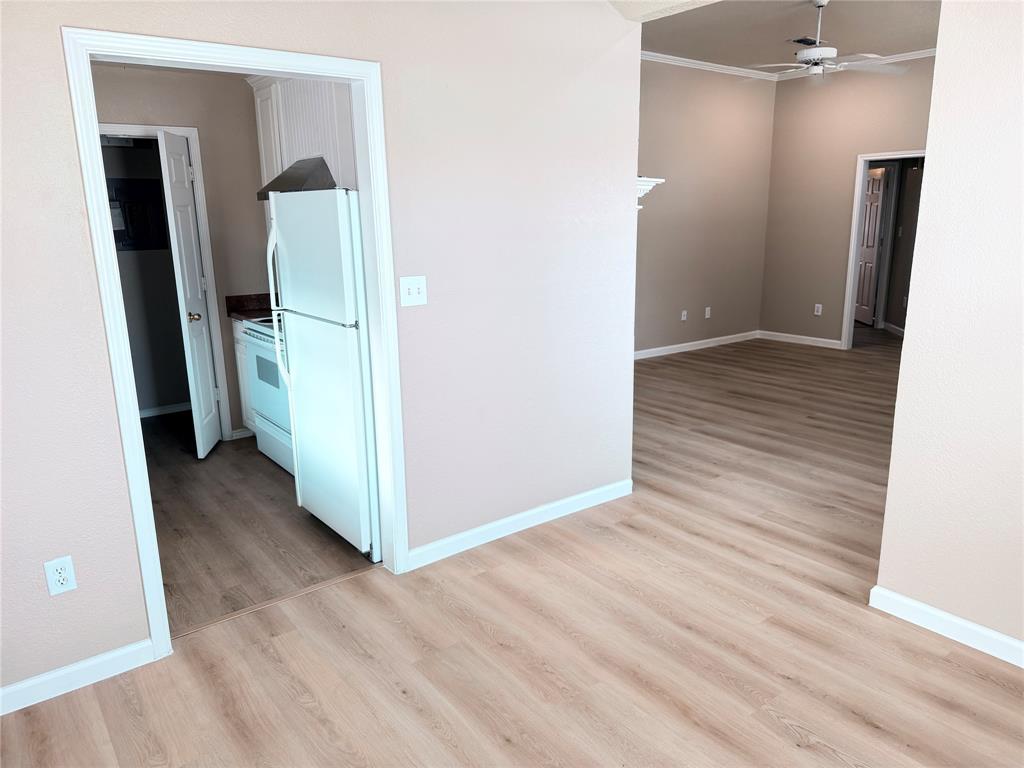 453 Strata Drive Denton, TX 76201 - Photo 12 of 15 a view of hallway with wooden floor