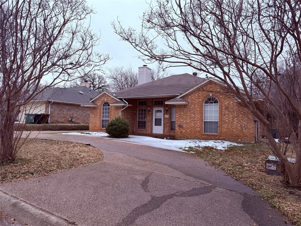453 Strata Drive Denton, TX 76201 - Photo 2 of 15 a front view of a house with a yard and trees