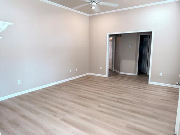 a view of room with wooden floor
