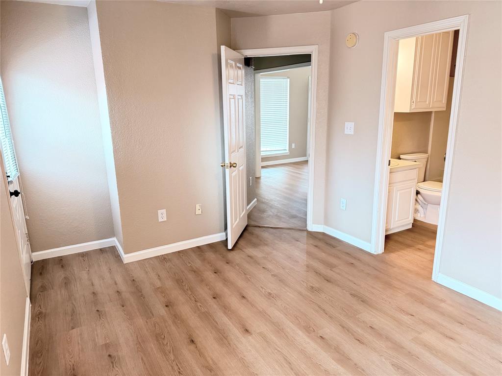 453 Strata Drive Denton, TX 76201 - Photo 6 of 15 an empty room and wooden floor