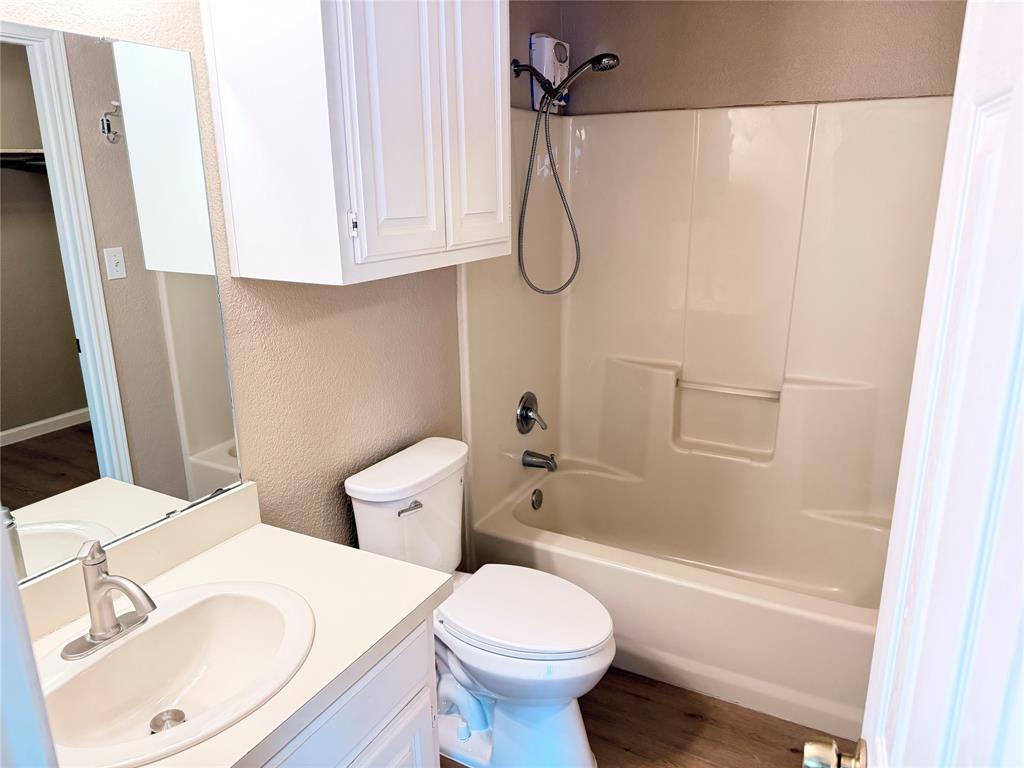 453 Strata Drive Denton, TX 76201 - Photo 7 of 15 a bathroom with a sink a toilet and shower
