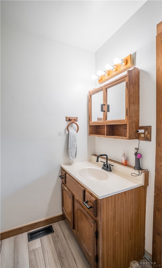 220 Racer Street Troy, OH 45373 - Photo 19 of 33 This bright bathroom features a vanity with ample storage and contemporary fixtures.