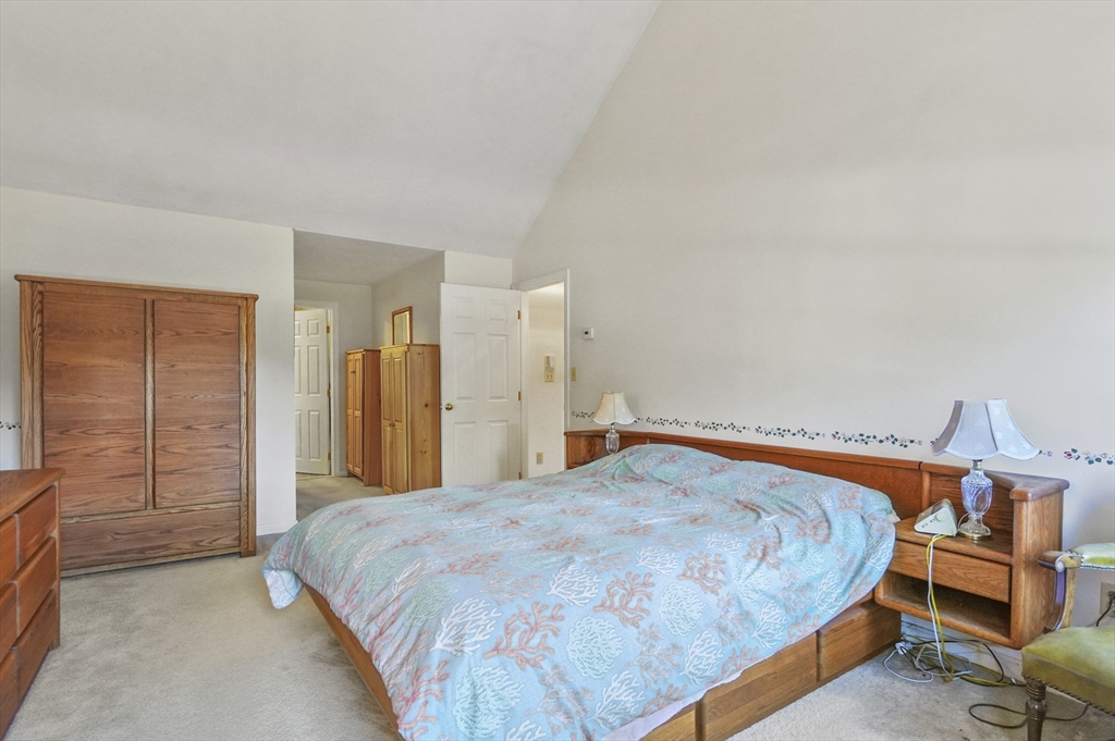 4 Jonathans Way Upton, MA 01568 - Photo 15 of 35 a bedroom with a bed and wooden floor