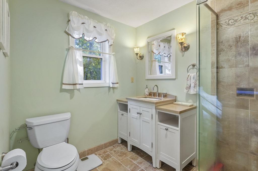 4 Jonathans Way Upton, MA 01568 - Photo 17 of 35 a bathroom with a toilet sink and mirror