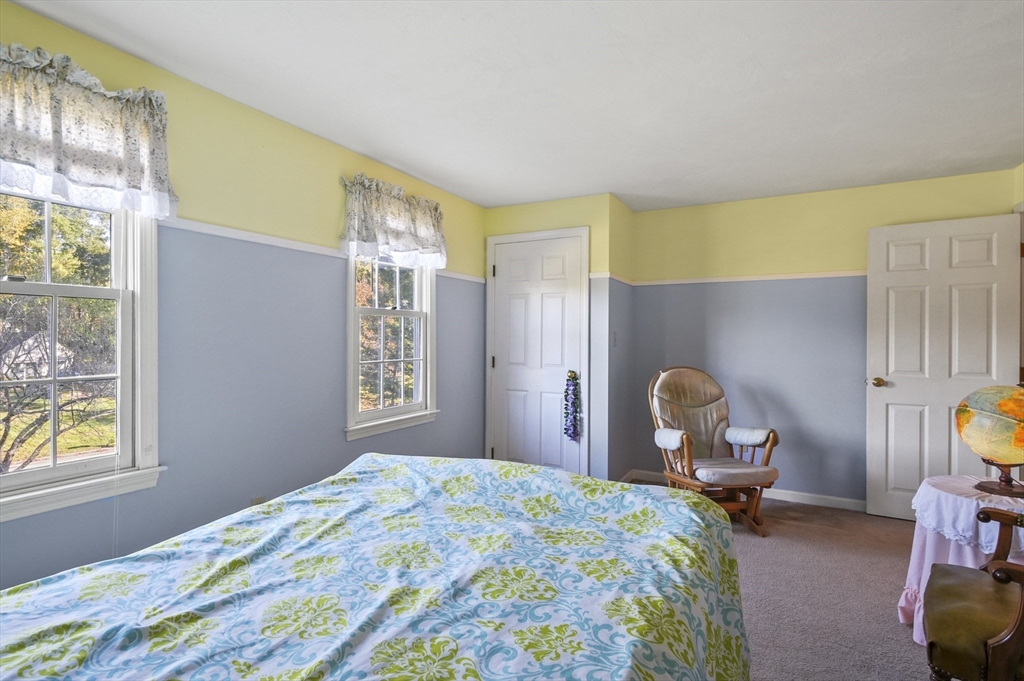 4 Jonathans Way Upton, MA 01568 - Photo 19 of 35 a bedroom with a bed and a window