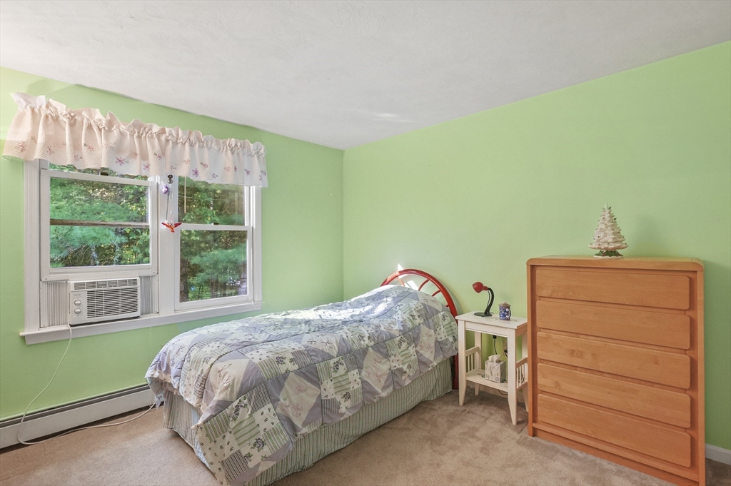 4 Jonathans Way Upton, MA 01568 - Photo 20 of 35 a bedroom with a bed and a window